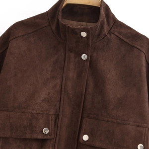 Dark brown faux suede jacket with stand collar and silver metal buttons on a hanger