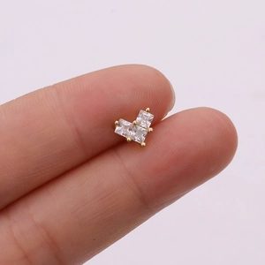 Close-up of rose gold stud featuring three square cubic zirconia in a heart cluster