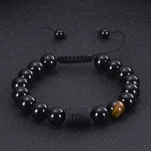 Detail of Virgo zodiac bracelet with black onyx beads and golden tiger eye stone
