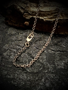 Vintage bronze style 60cm chain necklace with lobster clasp on dark textured background
