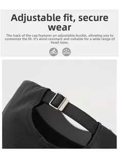Detail of adjustable metal buckle and fabric strap on a black mesh baseball cap