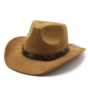 Detail of brown suede cowboy hat with vintage bull head emblem on leather band
