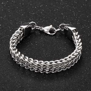Close-up of polished silver Byzantine chain link bracelet with durable lobster clasp