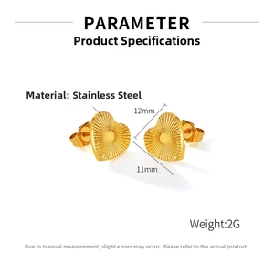 Detail of gold-plated stainless steel heart earrings with radiant textured design