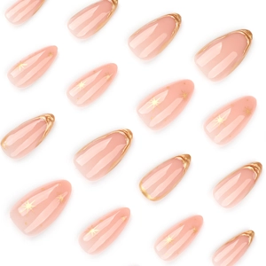 Short almond press on nails with nude pink base, gold french tips and star patterns