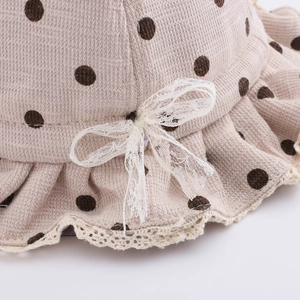 Cute beige polka dot baby sun hat with lace bow and scalloped edge for autumn