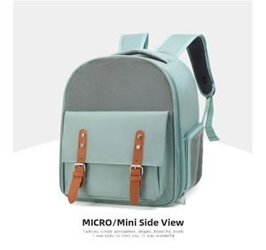 Detail view of mint green pet carrier backpack showing breathable grey mesh and leather straps