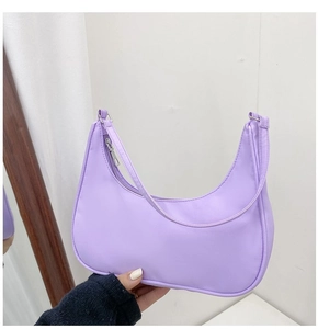 Detail of light purple nylon hobo bag featuring smooth texture and metal zipper closure