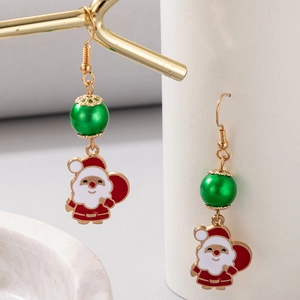 Detail of Christmas Santa Claus earrings with green beads and gold metal hooks