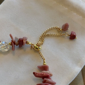 Detail of pink baroque rose stone and freshwater pearl bracelet with adjustable golden clasp