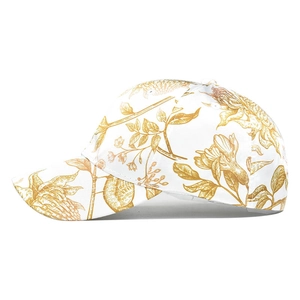 Side view of white baseball cap featuring vintage gold floral patterns and curved brim