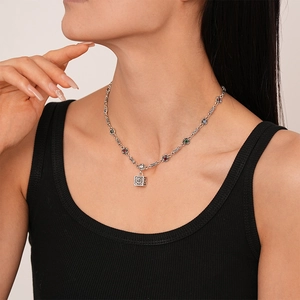 Vintage silver necklace with square patterned pendant and multi-colored gemstone inlay