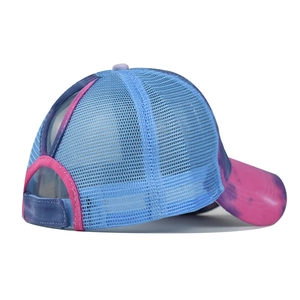 Detail of tie-dye ponytail sun hat showing breathable blue mesh and high hair opening