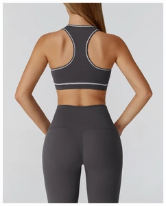 Detailed back view of racerback sports bra with contrast stitching and high waist leggings