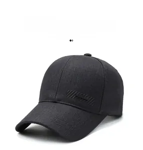 Detail of black cotton baseball cap showing 3D rubber SPORT logo and stripe texture