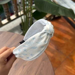 Linen texture headband featuring ocean starfish and seashell prints in white and blue