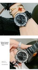 Detail of luxury watch with rhinestone bezel, sunray dial, and date window display