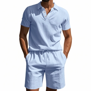 Detail of light blue linen polo shirt and drawstring shorts set for summer