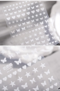 Detailed view of FS-033 white star, heart and butterfly nail art stickers on clear backing
