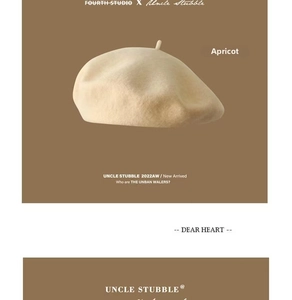 Detailed texture of high-quality apricot wool beret with soft minimalist finish