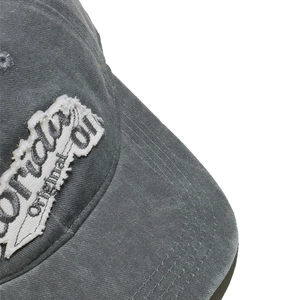 Close-up of gray washed fabric baseball cap with a raw edge patch and FLORIDA embroidery