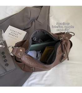 Deep brown tote showing spacious interior with wallet, cosmetics and a folding umbrella