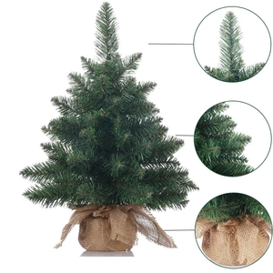 Mini artificial desktop Christmas tree with green needles and burlap wrapped base detail