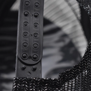 Detail of adjustable snapback closure on a black mesh sequin lace baseball cap