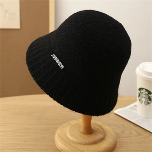 Minimalist black knitted striped bucket hat with fashion emblem for autumn and spring