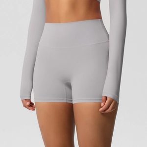 Macro detail of high-waist yoga shorts showing gray brushed fabric and seamless stitching