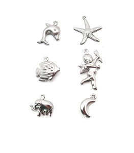Detail of silver stainless steel charms featuring dolphin, star, and elephant shapes
