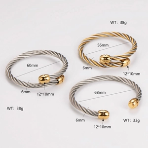 Three steel cable twist bangles in silver and gold, shown with size measurements