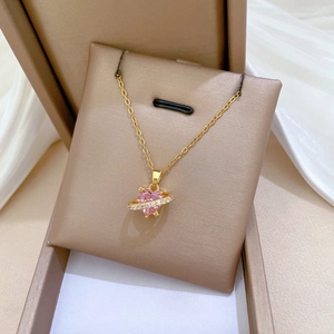 Titanium steel heart necklace with pink gemstone and crystal halo in a beige gift box
