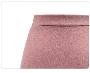 Macro detail of high-waist elastic band and stitching on pink knitted skirt