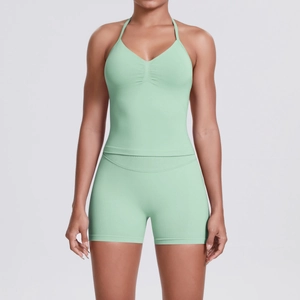Close-up of mint green seamless knitted yoga set showing textured fabric and ruching detail