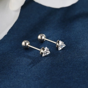 Macro shot of triangle cut crystal stud earrings with secure screw back ball closure