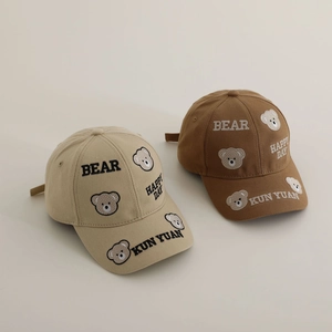 Detailed embroidery of bear and letters on beige and brown cotton baseball caps