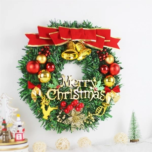Classic green Christmas wreath with red ornaments and Merry Christmas sign decoration