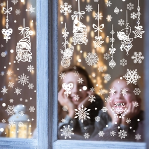 Christmas window stickers featuring snowflakes and gnomes on glass for holiday party decor