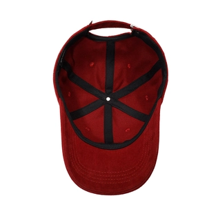 Inside view of burgundy cotton baseball cap showing 100% cotton label and reinforced seams