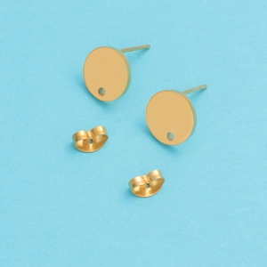 Detail view of round gold stainless steel flat-base stud earrings with butterfly backings