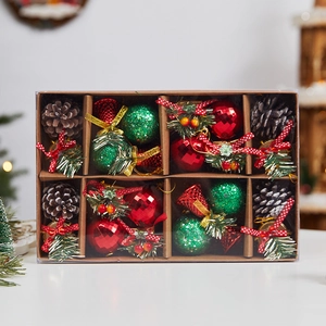 Christmas ornament set with pine cones, red bells and baubles in a brown window gift box