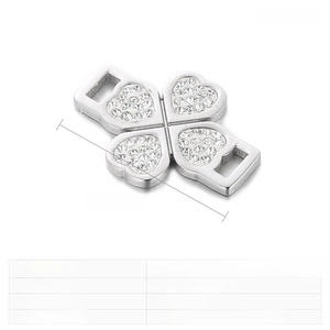 Macro view of stainless steel clover connector with zircons for DIY jewelry making