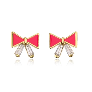 Detail of gold bow earrings with red enamel and rectangular zircon drops on white base