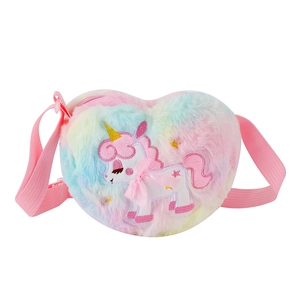 Detail of heart-shaped plush unicorn bag with rainbow faux fur and pink strap