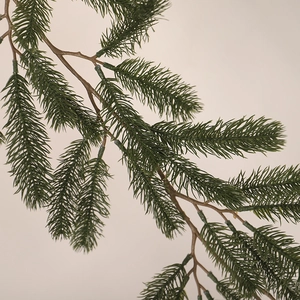 Realistic artificial pine branch with dense green needles for Christmas home decoration