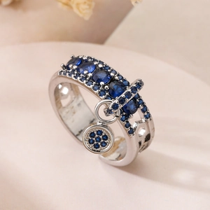 Silver-plated open ring with blue zircon pendant and sparkling crystal accents