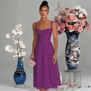 Detail of slim fit dark purple midi dress showing drawstring pleats and high slit