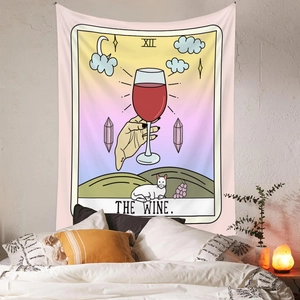 Detail of The Wine tarot style tapestry with a white cat and moons on bedroom wall