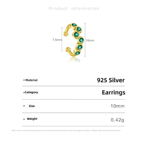 Macro view of gold S925 sterling silver ear cuff with five inlaid green gemstones